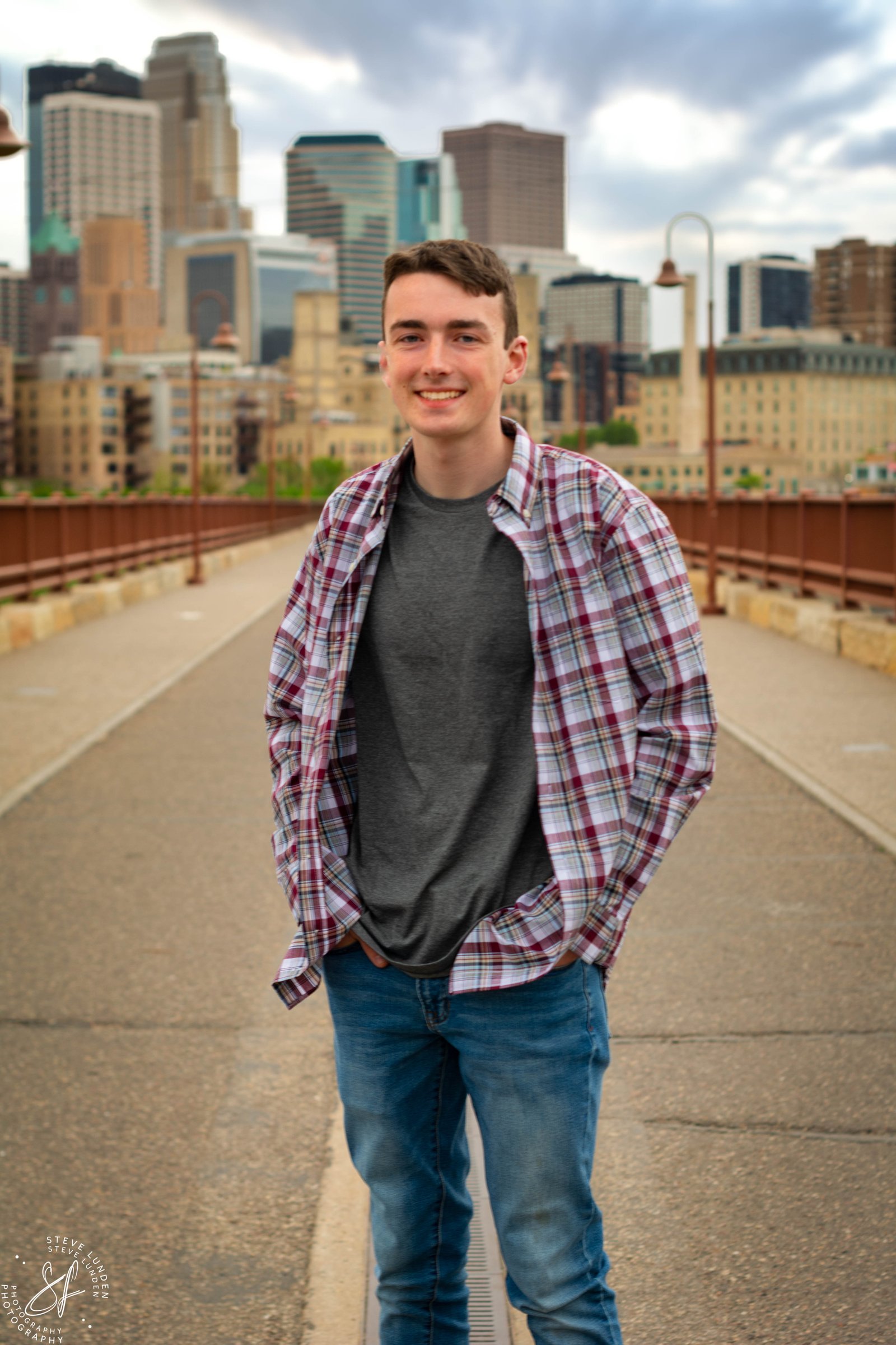 Minneapolis senior portrait downtown with skyline backdrop