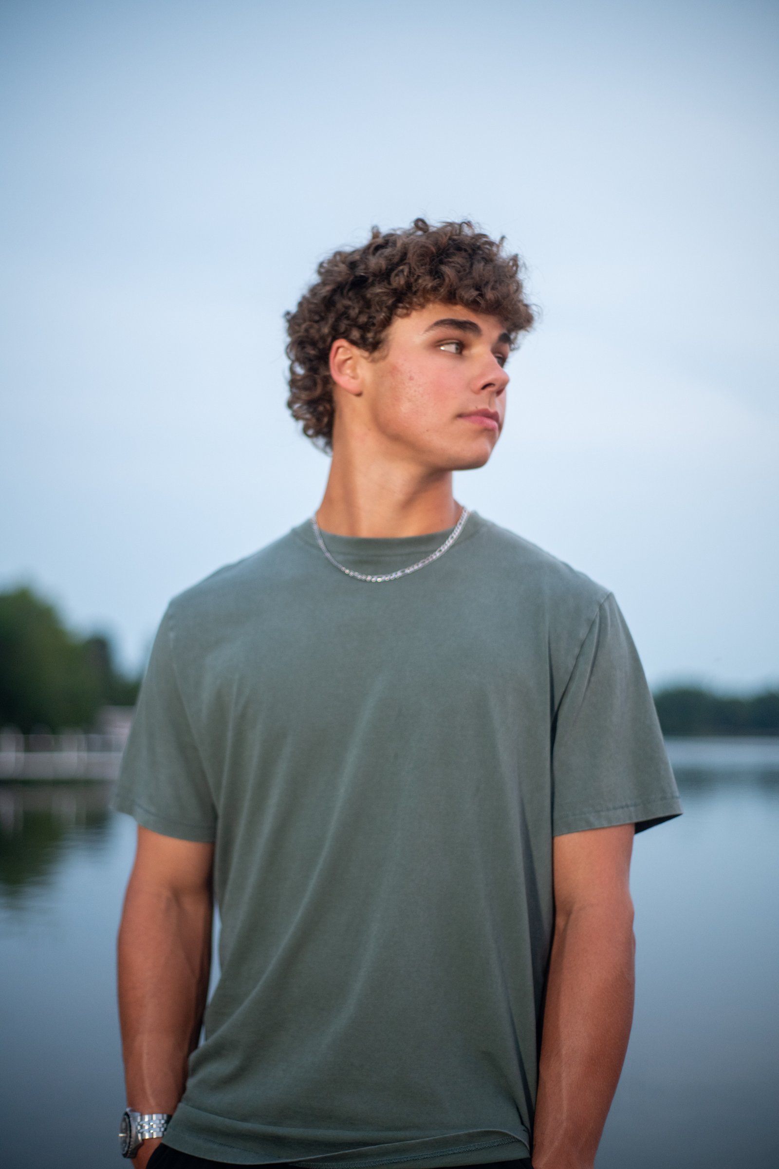 Senior posing at lake- flash portrait session Twin Cities MN