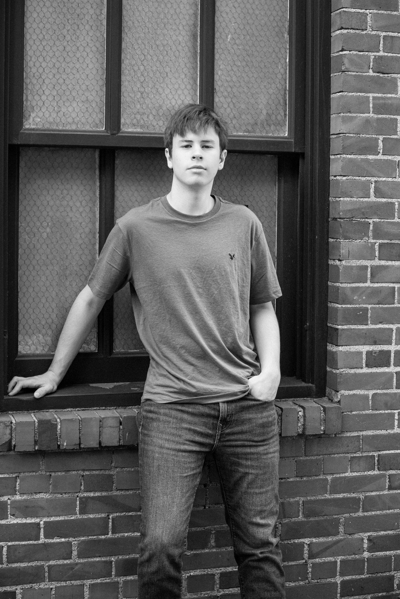 Senior portrait against brick wall - urban session Minneapolis senior photographer